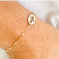 Bracelet religieux en or, nacre et email blanc